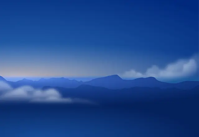 a blue sky with clouds and mountains